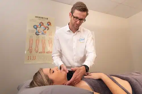 Gold Coast acupuncture therapist assessing client
